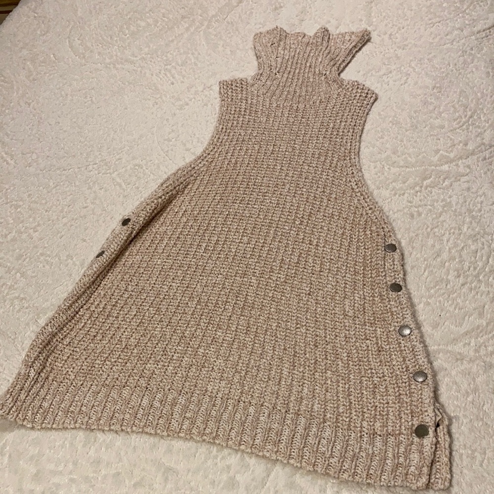 Knitted turtleneck sweater (sleeveless) by Free People.